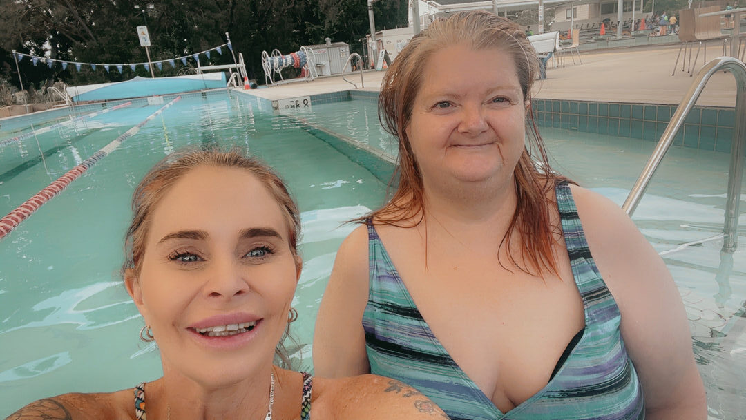 Lisa participating in aqua therapy with support from INREACH Supports during community participation