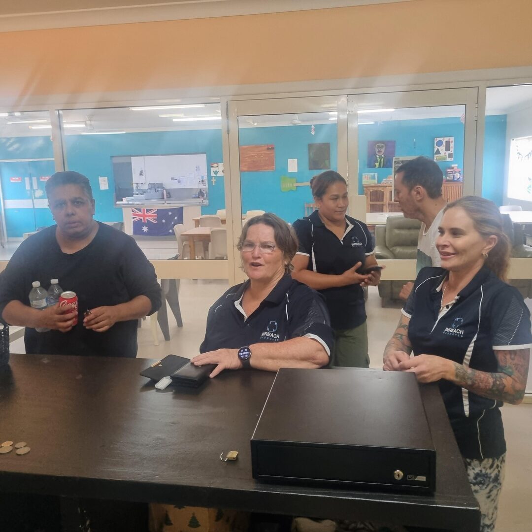 INREACH Supports staff queuing at the INREACH Shop, operated by clients at Christine Court Assisted Living